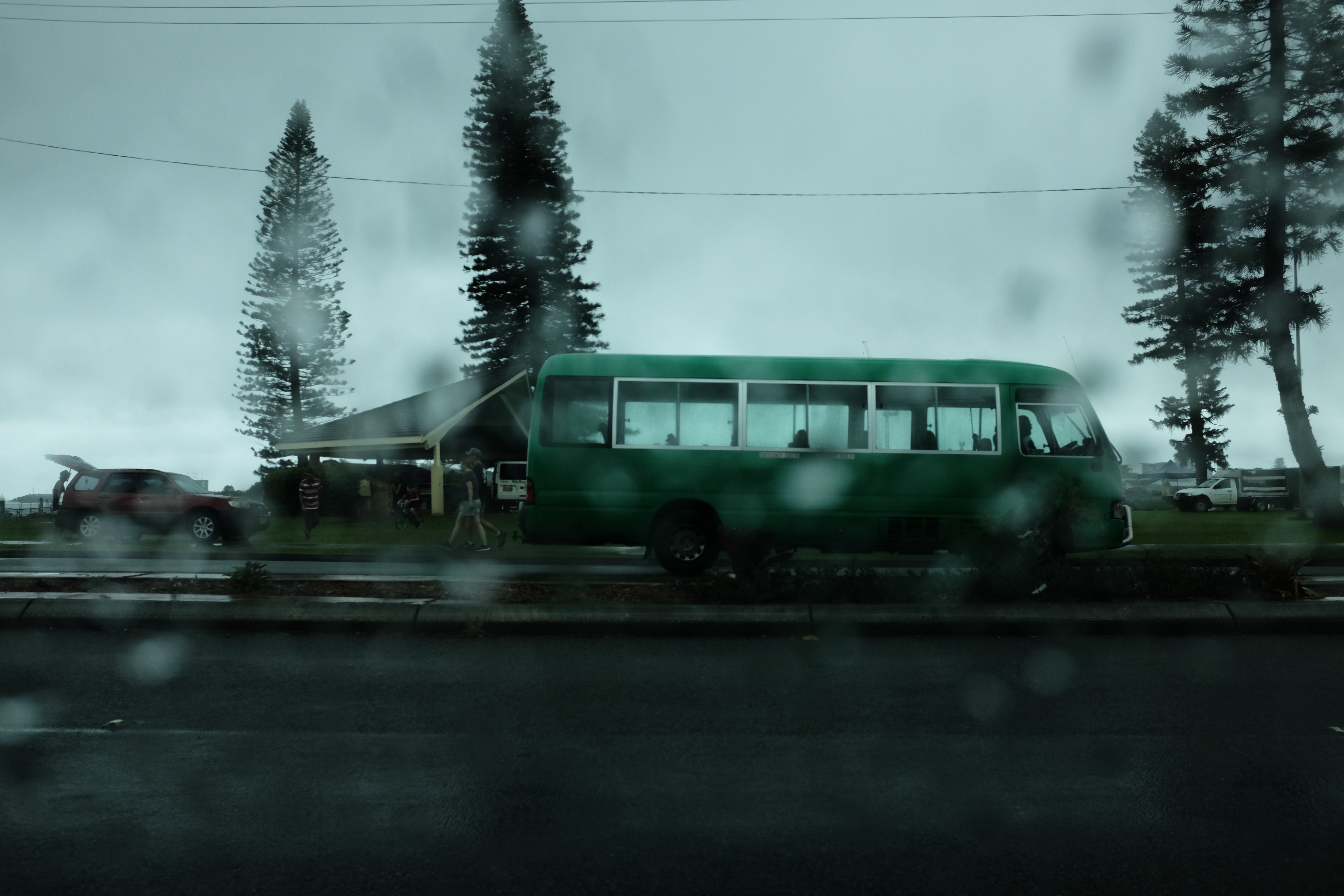 A green bus in rainy weather, Australia